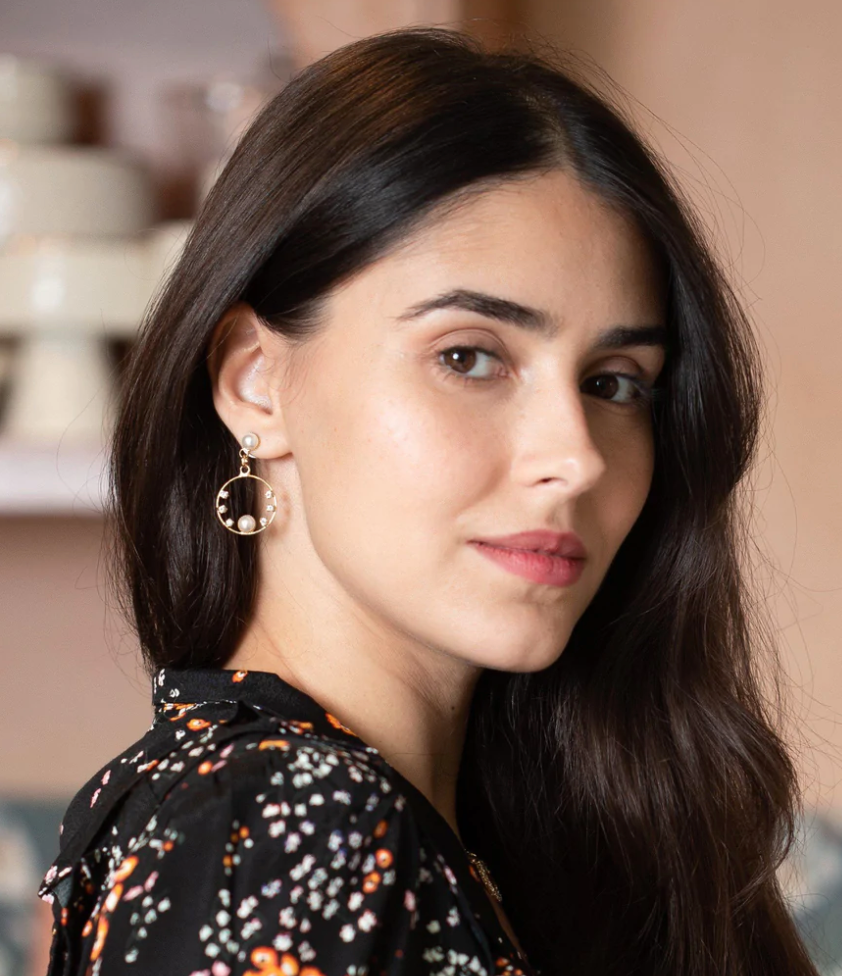 Coravana This unique but delicate design has a beautiful and shiny center piece, adorned with six glowing crystals to complete the look. They are approximately 3.5cm long. Plated in 24K.