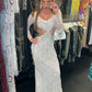 Diamond for Eden Long-sleeve long white gown with silver beads and stones all over.